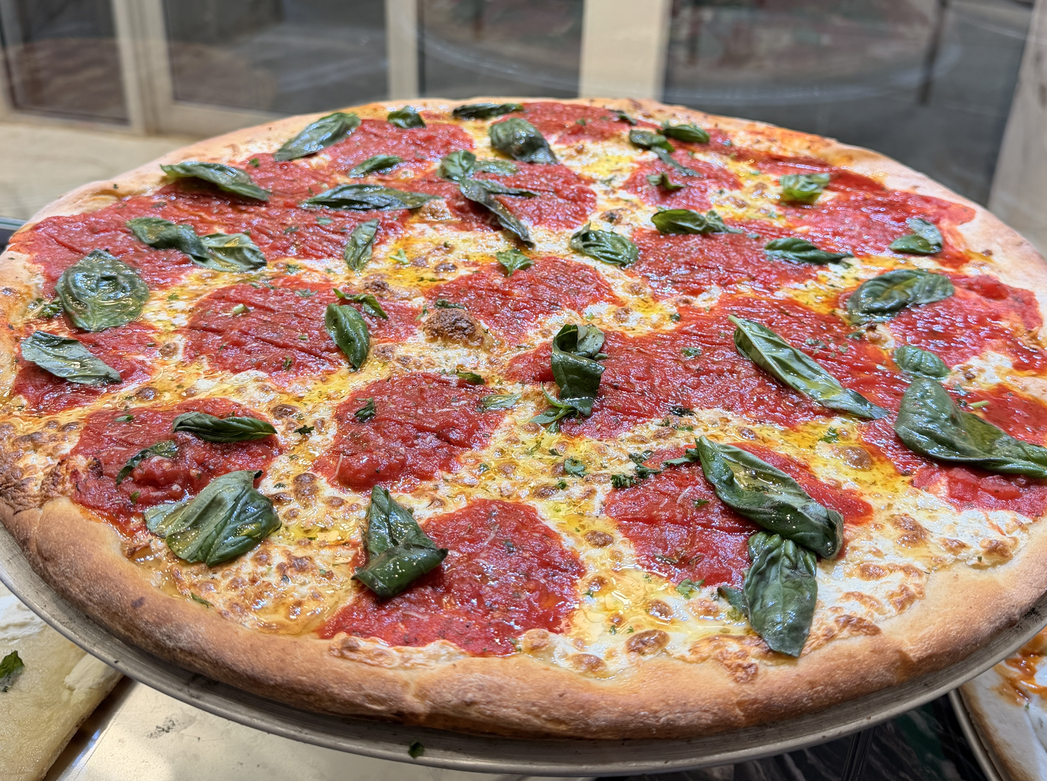 18-inch Margherita pizza with tomato, fresh mozzarella, and basil