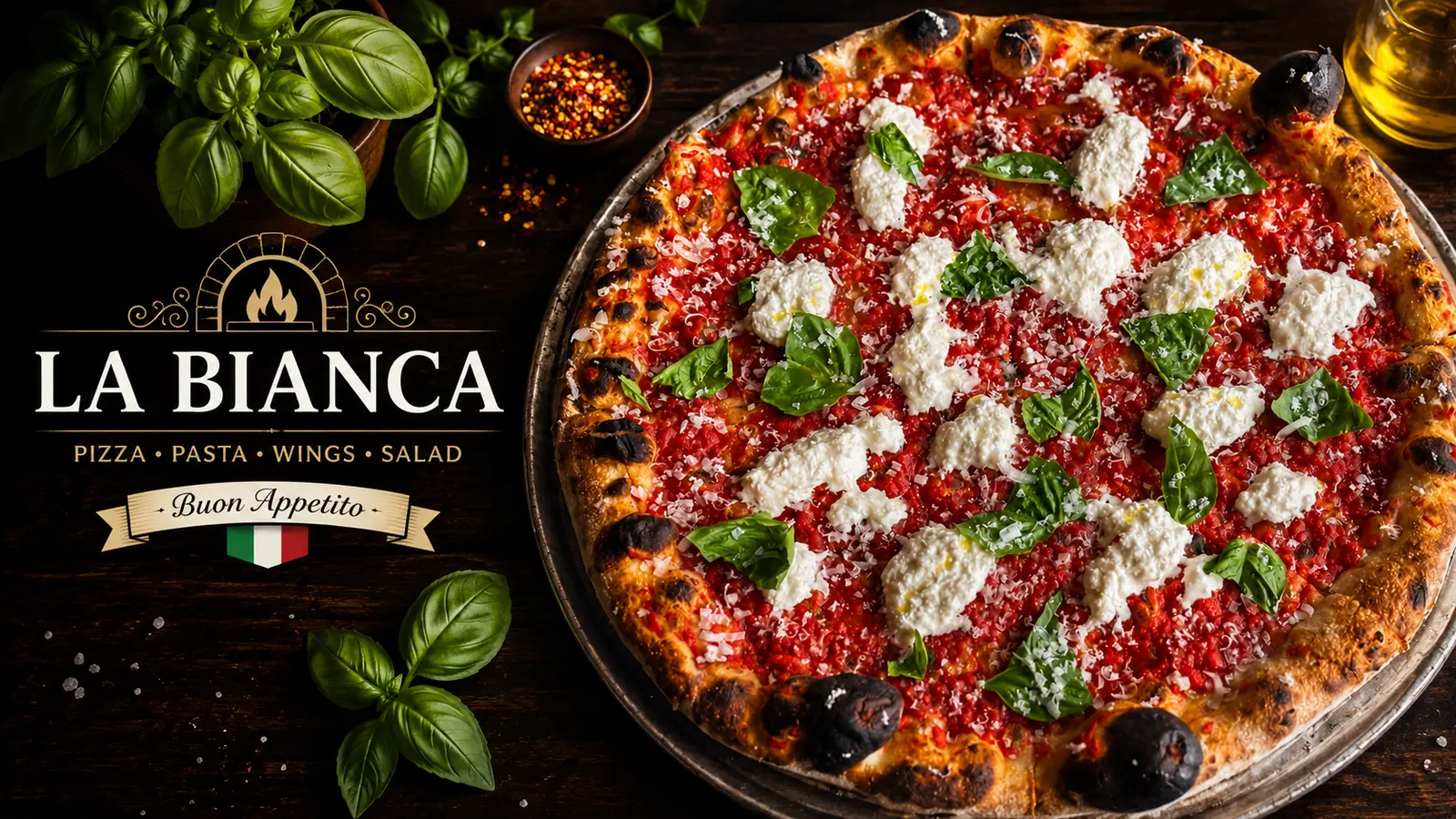 La Bianca house pizza with creamy burrata, tomato, and basil